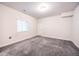 Carpeted bedroom with a window and closet door at 12652 Glencoe St, Thornton, CO 80241
