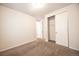Neutral bedroom with a closet and doorway to other rooms at 12652 Glencoe St, Thornton, CO 80241