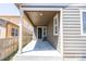 A covered patio with concrete flooring is visible, offering a shaded outdoor space for relaxation and entertainment at 12652 Glencoe St, Thornton, CO 80241