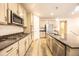 Kitchen featuring a center island, stainless steel appliances and modern cabinets at 12652 Glencoe St, Thornton, CO 80241