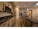 Well-equipped kitchen featuring stainless steel appliances, granite countertops, and ample cabinetry at 12652 Glencoe St, Thornton, CO 80241