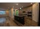 Gourmet kitchen featuring an island, stainless steel appliances, and built-in microwave at 12652 Glencoe St, Thornton, CO 80241