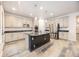 Modern kitchen with stainless steel appliances, granite counters, island and abundant cabinet space at 12652 Glencoe St, Thornton, CO 80241