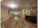 Open-concept living area with a fireplace, island kitchen, and abundant natural light at 12652 Glencoe St, Thornton, CO 80241