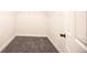 An organized walk-in closet with gray carpet and ample storage space, ready for personalization at 12652 Glencoe St, Thornton, CO 80241