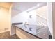 Granite countertop wet bar near the finished basement staircase at 12652 Glencoe St, Thornton, CO 80241