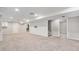 Spacious basement with new carpet, recessed lighting, and access to the stairway at 10482 W 75Th Ave, Arvada, CO 80005