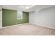 Bedroom boasts a neutral carpet, large window, and neutral paint at 10482 W 75Th Ave, Arvada, CO 80005