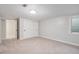 Neutral bedroom boasts closet space, a large window, and neutral paint at 10482 W 75Th Ave, Arvada, CO 80005