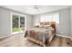 Cozy bedroom with light-filled sliding glass door to the backyard at 10482 W 75Th Ave, Arvada, CO 80005