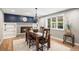 Charming dining area with a brick fireplace, built-in shelves and large window at 10482 W 75Th Ave, Arvada, CO 80005