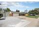 Charming single-story home featuring a basketball court, a well-manicured lawn, and blue sky at 10482 W 75Th Ave, Arvada, CO 80005