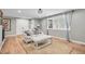 Bright living room with neutral decor, large windows, and hardwood floors at 10482 W 75Th Ave, Arvada, CO 80005