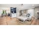 A bright and airy living room that seamlessly connects to a modern kitchen at 10482 W 75Th Ave, Arvada, CO 80005