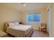 Basement bedroom with window and neutral decor at 8588 W Quarles Pl, Littleton, CO 80128