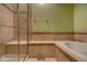 Bathroom with soaking tub, shower, and tile at 8588 W Quarles Pl, Littleton, CO 80128