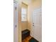 Inviting entryway with built-in bench, window, and coat closet at 8588 W Quarles Pl, Littleton, CO 80128