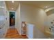 Bright hallway with hardwood floors and access to bedrooms at 8588 W Quarles Pl, Littleton, CO 80128