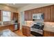 Kitchen with stainless steel appliances and granite countertops at 8588 W Quarles Pl, Littleton, CO 80128