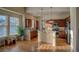 Well-lit kitchen with hardwood floors and island at 8588 W Quarles Pl, Littleton, CO 80128