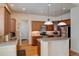 Well-equipped kitchen featuring granite counters and ample cabinetry at 8588 W Quarles Pl, Littleton, CO 80128