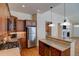 Modern kitchen with stainless steel appliances and granite countertops at 8588 W Quarles Pl, Littleton, CO 80128