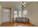 Bright living room with hardwood floors and fireplace at 8588 W Quarles Pl, Littleton, CO 80128