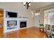 Living room with built-in entertainment center and fireplace at 8588 W Quarles Pl, Littleton, CO 80128