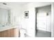 Clean bathroom featuring a modern vanity, sleek fixtures, and convenient closet space at 2880 Zuni St # 406, Denver, CO 80211