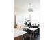 Dining area and living space featuring a contemporary table, chairs, and stylish decor for comfortable living at 2880 Zuni St # 406, Denver, CO 80211