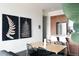 Dining area adjacent to the kitchen featuring modern art, an open layout, and comfortable seating for meals at 2880 Zuni St # 406, Denver, CO 80211