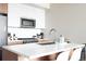 Bright, modern kitchen with sleek white countertops, stainless steel appliances, and plenty of natural light at 2880 Zuni St # 406, Denver, CO 80211