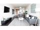 Open-concept living room connects to the kitchen and offers comfortable seating and modern decor at 2880 Zuni St # 406, Denver, CO 80211