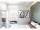 Bright bedroom featuring a balcony, cityscape views, and modern artistic decor at 2880 Zuni St # 406, Denver, CO 80211