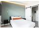 Charming bedroom with ambient lighting, sliding barn door, and modern decor at 2880 Zuni St # 406, Denver, CO 80211