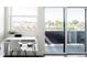 Bright office space with built in desk and large windows with adjacent balcony access at 2880 Zuni St # 406, Denver, CO 80211
