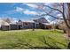 Spacious backyard with a covered patio, shed, and well-maintained lawn perfect for outdoor activities at 7923 S Marion Ct, Centennial, CO 80122