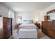 Bright bedroom with ample natural light, plush carpeting, and a neatly arranged bed with coordinating furniture at 7923 S Marion Ct, Centennial, CO 80122