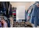 Walk-in closet with organized clothing racks, shelves and shoe storage, with a window providing natural light at 7923 S Marion Ct, Centennial, CO 80122