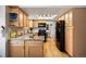 Kitchen features maple cabinets, granite countertops, and stainless steel appliances at 7923 S Marion Ct, Centennial, CO 80122