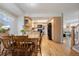 Kitchenette features wood cabinets and a light countertop, open to the living room at 7923 S Marion Ct, Centennial, CO 80122