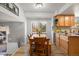 Kitchenette with wood cabinets, light countertops, and a wood table with chairs and a bench at 7923 S Marion Ct, Centennial, CO 80122