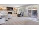 Carpeted living room features a fireplace, built-in shelving, and a sliding door to the patio at 7923 S Marion Ct, Centennial, CO 80122