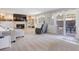 Cozy living room features a fireplace, built-in shelves, a slider leading to a patio at 7923 S Marion Ct, Centennial, CO 80122