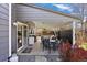 Enjoy outdoor dining on the covered patio adjacent to the home and backyard at 7923 S Marion Ct, Centennial, CO 80122