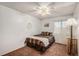 Cozy bedroom with ceiling fan, bed, lamp, and window at 13339 E Idaho Pl, Aurora, CO 80012