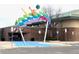 Modern building featuring an artistic, colorful sculpture at the front entrance at 13339 E Idaho Pl, Aurora, CO 80012