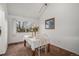 Cozy dining room features a window view, a table set for two, and neutral carpet at 13339 E Idaho Pl, Aurora, CO 80012