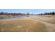 Expansive golf course landscape with a serene pond, offering a scenic view at 13339 E Idaho Pl, Aurora, CO 80012