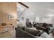 Bright living room featuring large windows, neutral carpet and two comfortable sofas at 13339 E Idaho Pl, Aurora, CO 80012